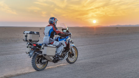 Africa Twin Adventure with rider and sunset